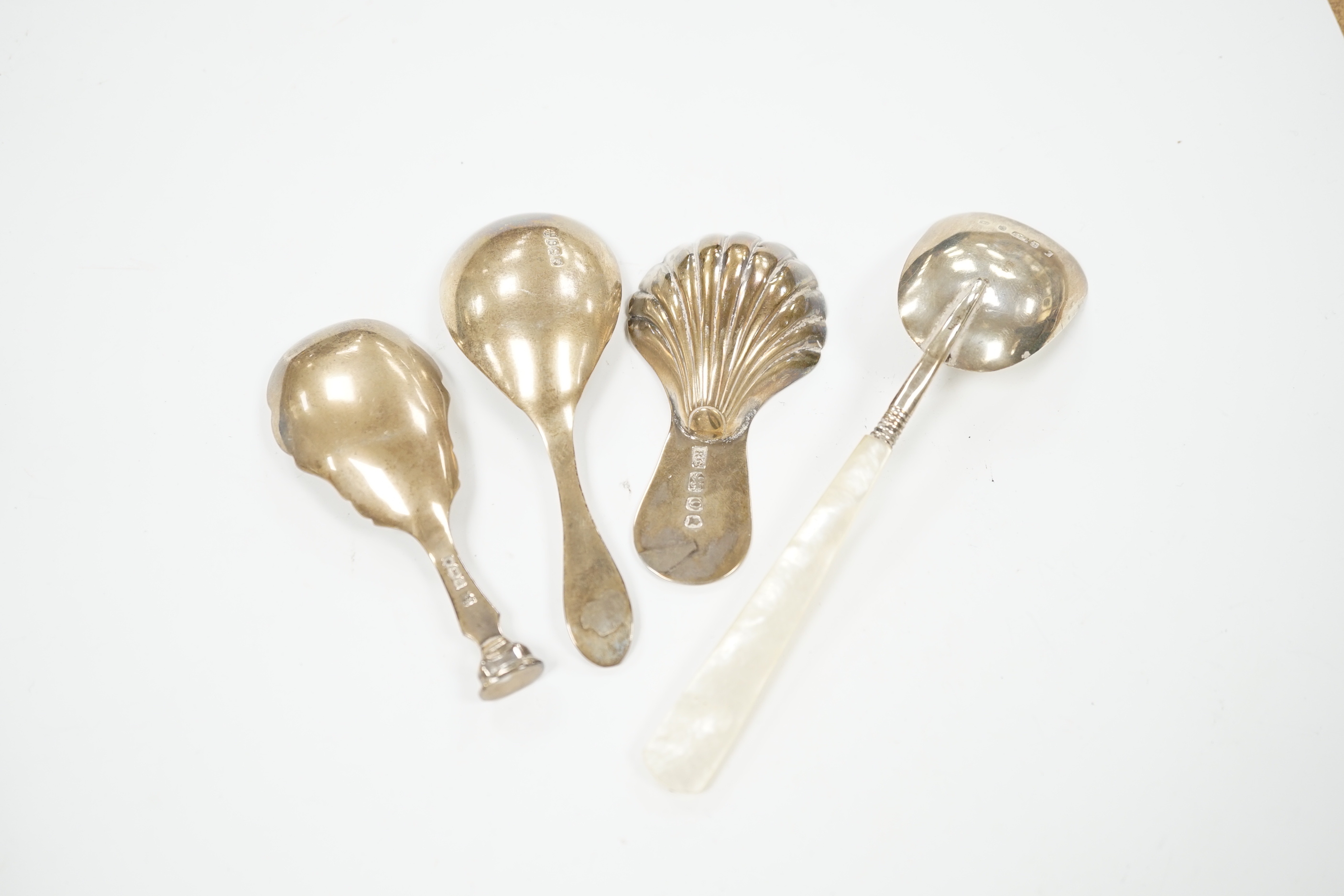 Two 19th century silver caddy spoons including mother of pearl handled by George Unite, 12.1cm and two later silver caddy spoons.